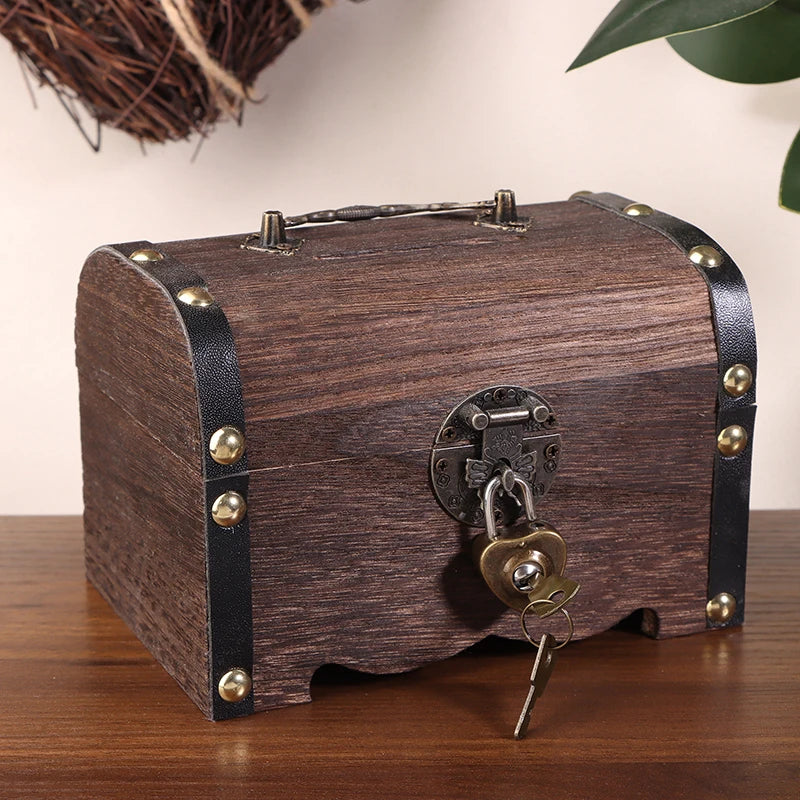 Wooden treasure chest with a lock and key on a wooden surface.