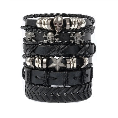 Stack of black leather bracelets with metal skull and star charms on a white background