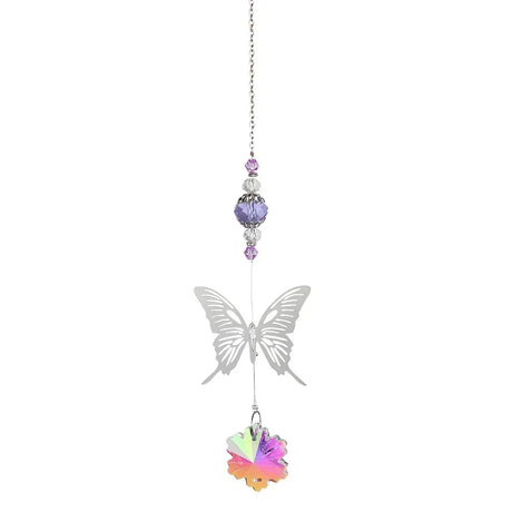 Butterfly-shaped ornament with colorful gemstones on a white background