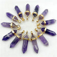 Purple crystal pendants with gold accents arranged in a circular pattern on a white background
