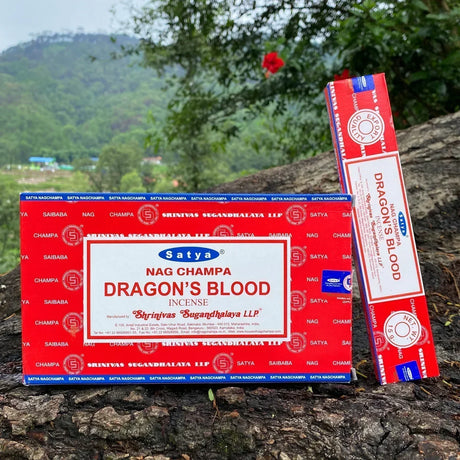 Satya Nag Champa Dragon's Blood incense packaging on a natural background
