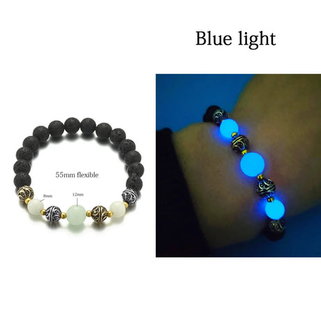 Glowing bracelet with blue light on a wrist against a dark background