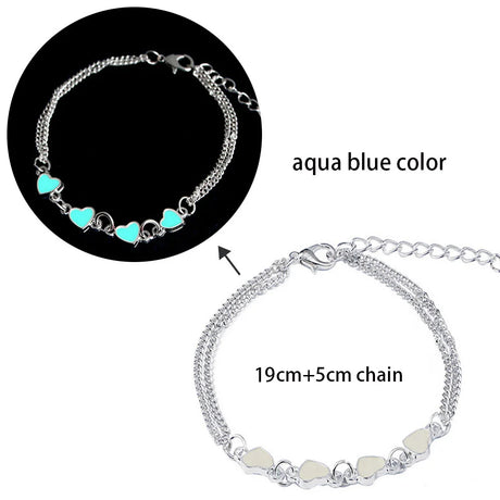 Bracelet with aqua blue heart-shaped beads and silver chain on a white background