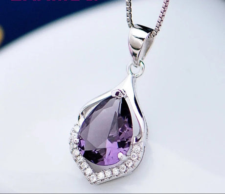 Purple teardrop pendant necklace with silver chain on a white background, featuring the brand 'YAMLILI'.