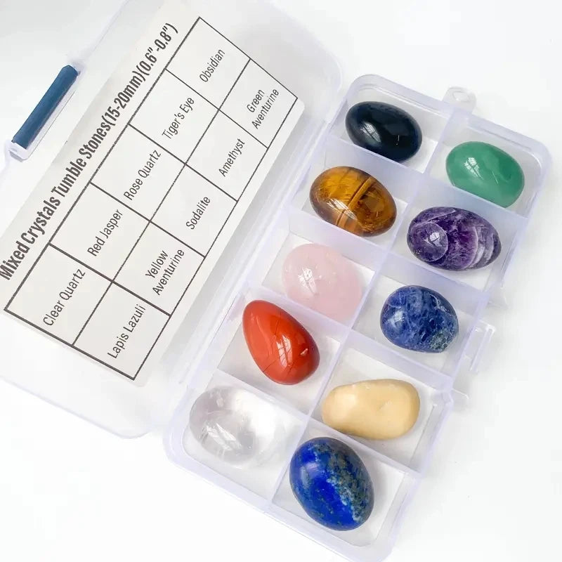 Set of mixed crystals in a clear plastic case with labels on a white background