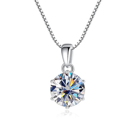 Silver necklace with a round, clear gemstone pendant on a white background