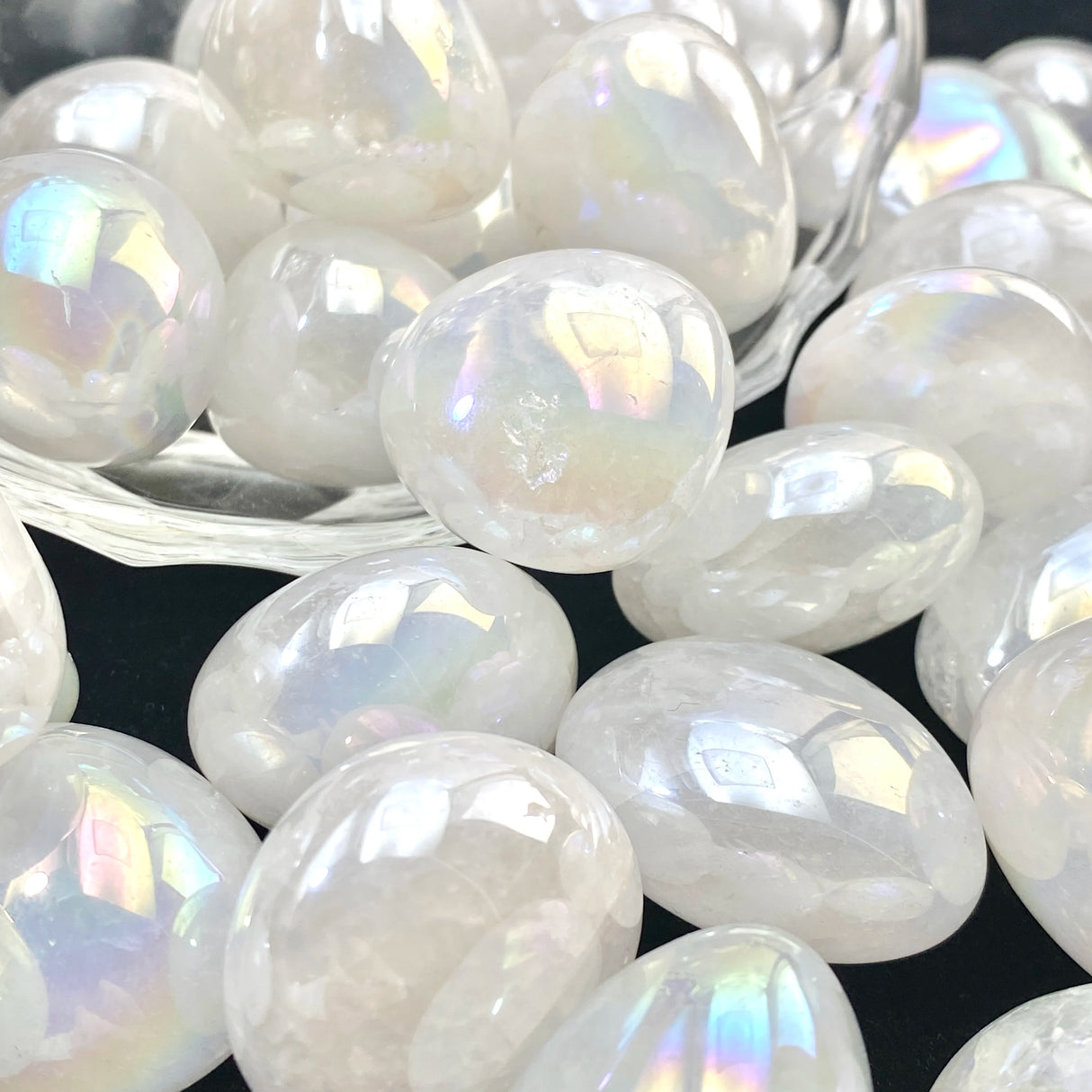 White iridescent beads on a dark background