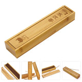 Bamboo incense box with incense sticks on a white background