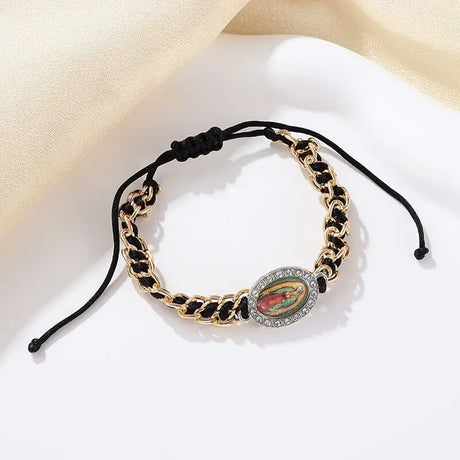 Bracelet with gold chain and decorative element on a light background
