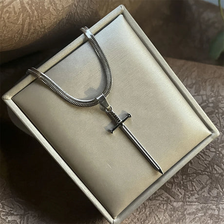 Silver necklace with a unique pendant on a textured surface