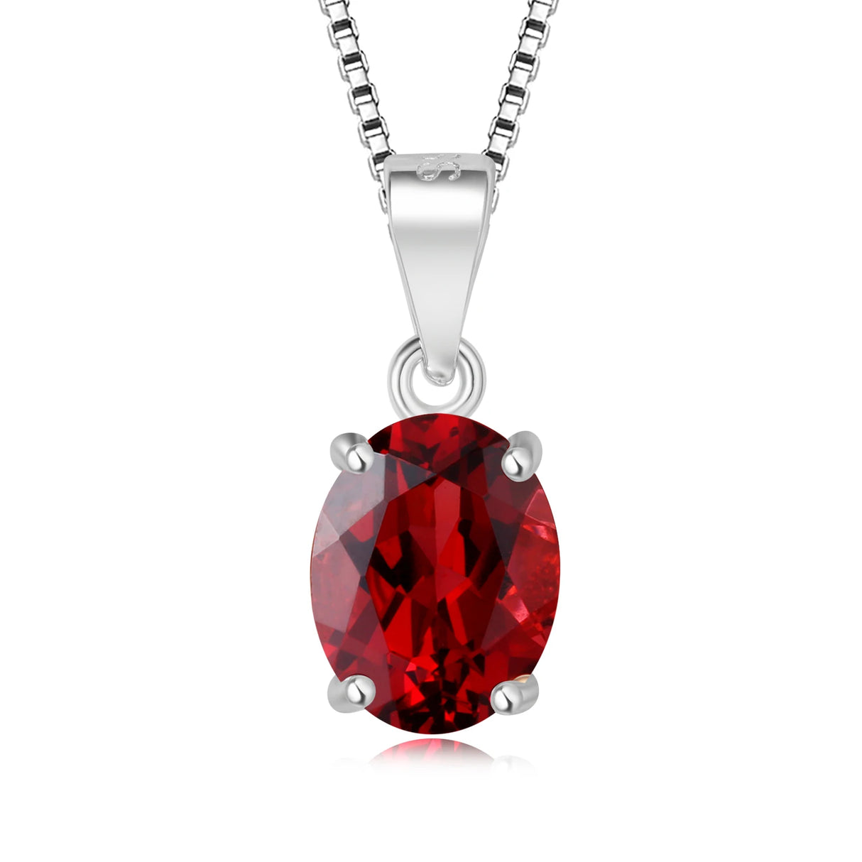 Red gemstone pendant on a silver chain against a white background