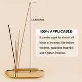 Gold incense burner with incense sticks on a beige background, showing dimensions and usage information.