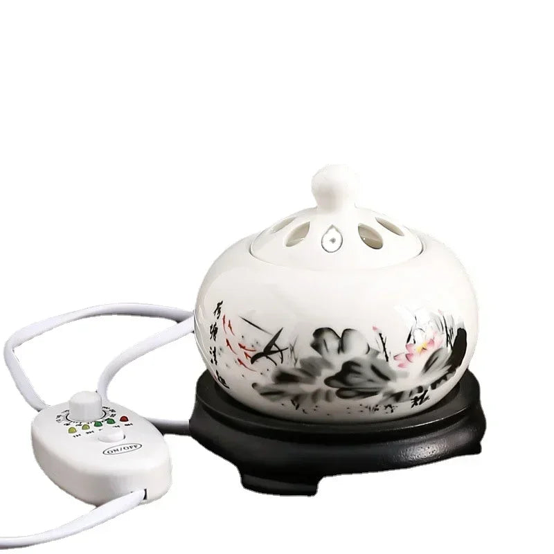 Ceramic oil burner with floral design on a white background