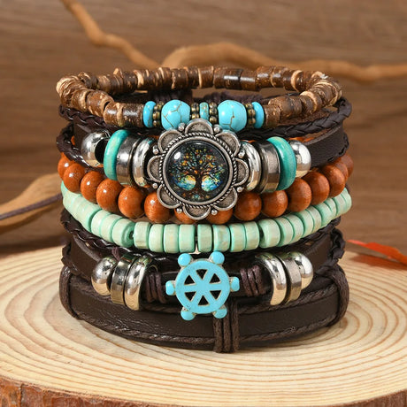 Stack of colorful beaded bracelets with decorative elements on a wooden surface