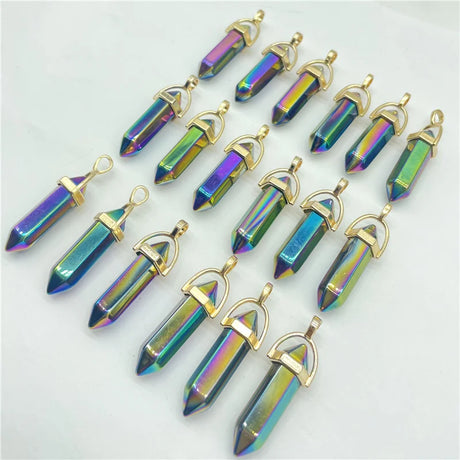 Iridescent crystal pendants with gold accents on a light gray background