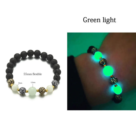 Glowing bracelet with black, white, and gold beads on a white background.