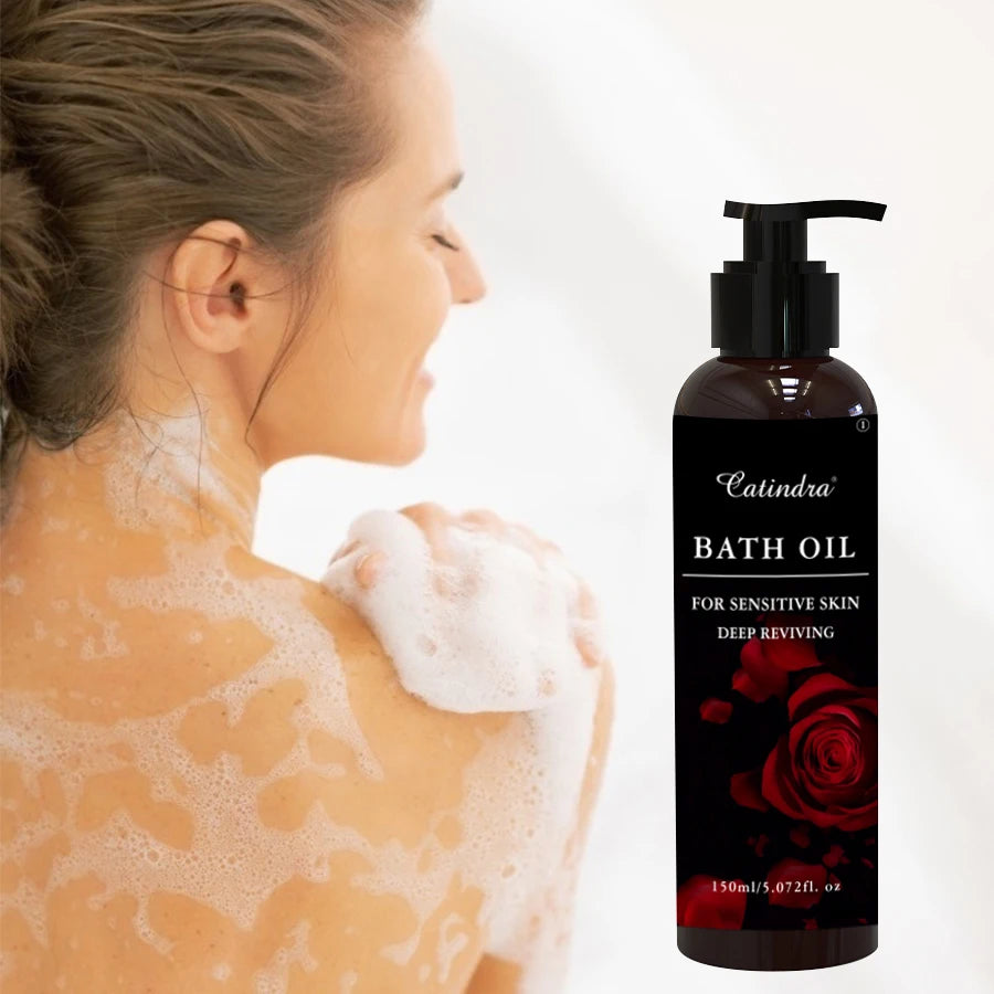 Woman with soap suds on her back next to a bottle of Catindra bath oil.