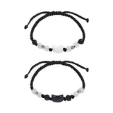 Two black and white beaded bracelets on a white background
