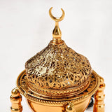Decorative gold lantern with intricate designs on a white background