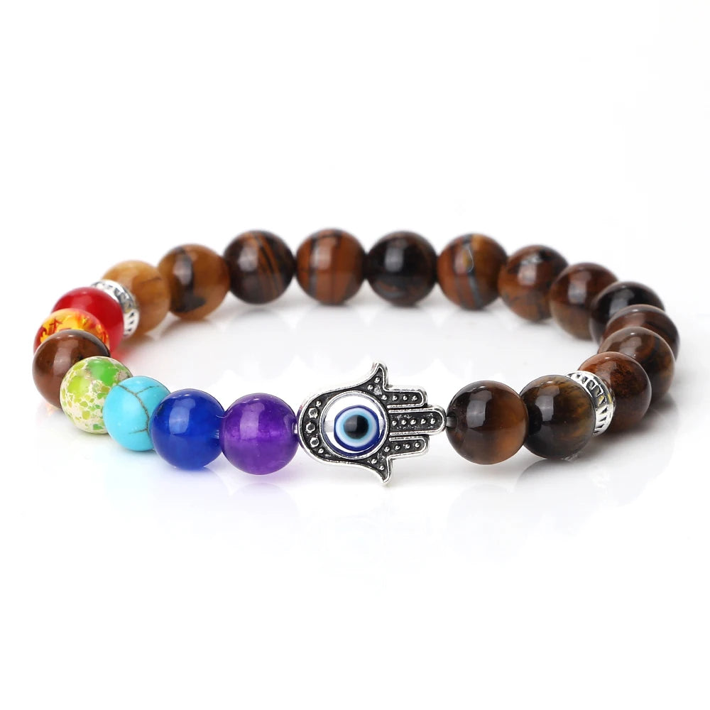 Multicolored beaded bracelet with a Hamsa hand charm on a white background