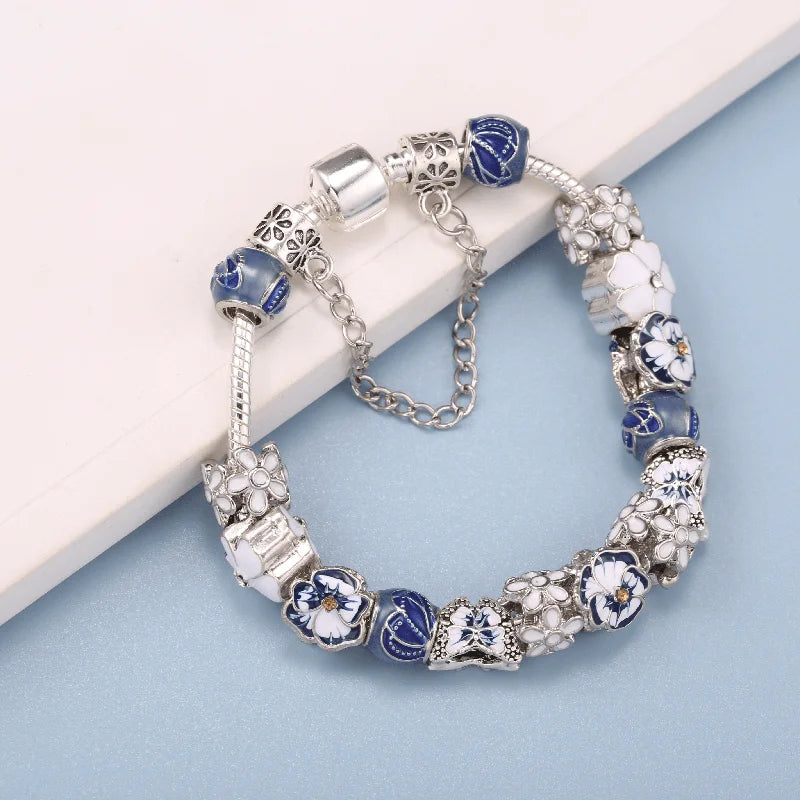 Bracelet with blue and white beads on a light blue background