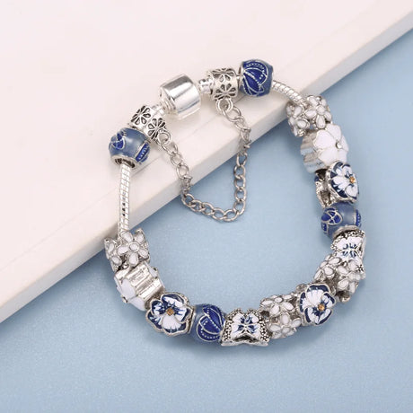 Bracelet with blue and white beads on a light blue background