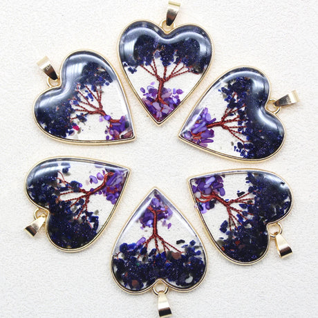 Set of heart-shaped purple tree pendants on a white background