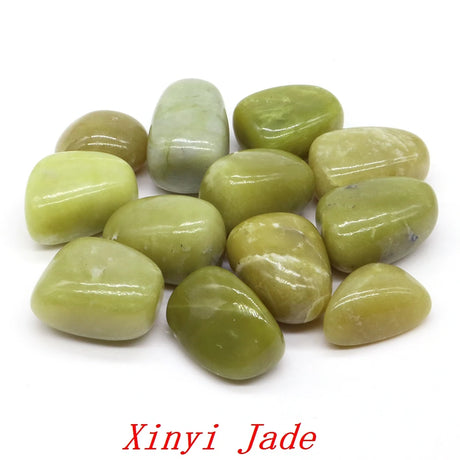 Collection of green jade stones on a white background with 'Xinyi Jade' branding.