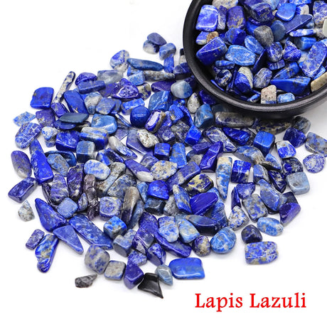 Lapis Lazuli stones with a bowl of stones on a white background.