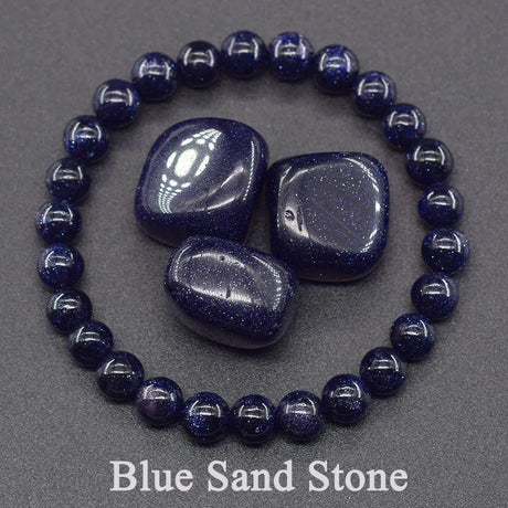 Blue sandstone beads and tumbled stones on a gray background with 'Blue Sand Stone' text.