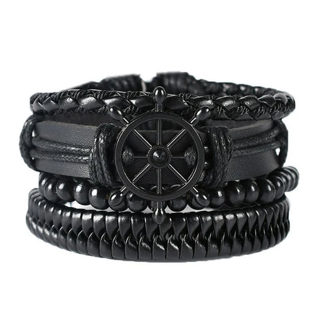 Black braided leather bracelet with a ship's wheel charm on a white background