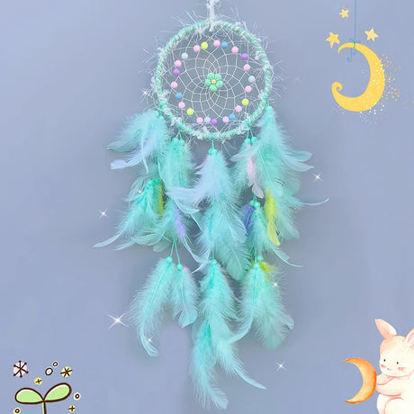 Turquoise dreamcatcher with colorful beads and feathers on a light blue background