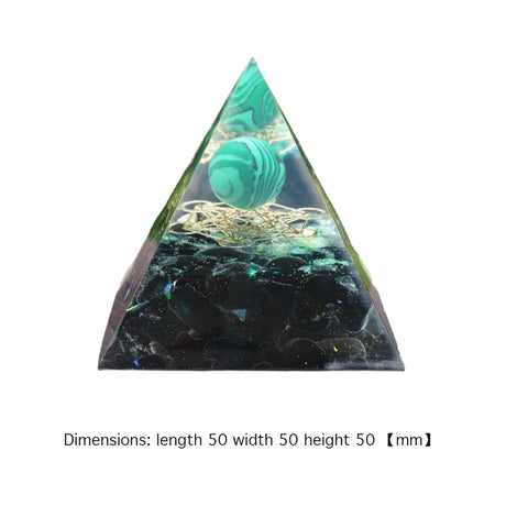 Triangular crystal with green and black marbled design on a white background