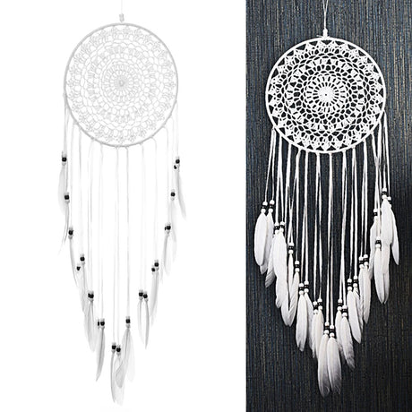 White dreamcatcher with feathers on a white background