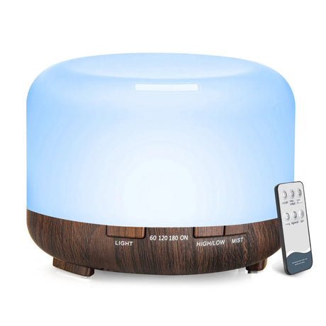 Aromatherapy diffuser with wooden base and remote control on a white background