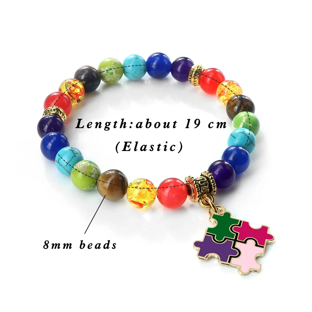 Colorful beaded bracelet with a puzzle piece charm on a white background