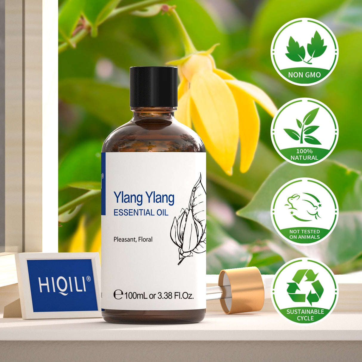 Ylang Ylang essential oil bottle with HIQILI branding on a natural background