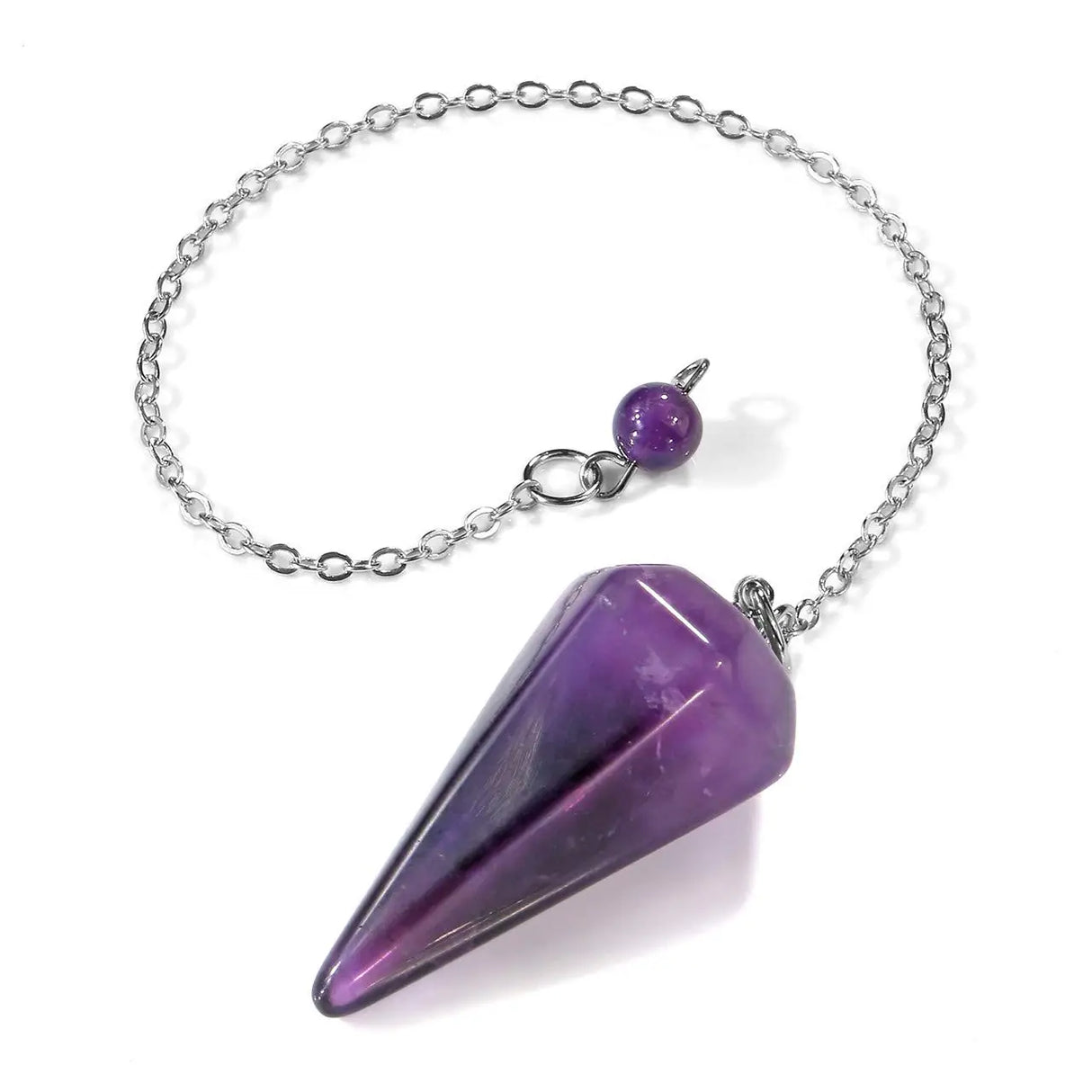 Purple crystal pendulum on a silver chain against a white background
