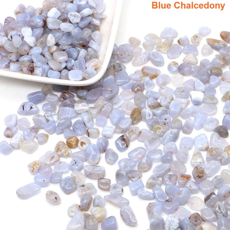 Blue chalcedony stones with a white scoop on a light background