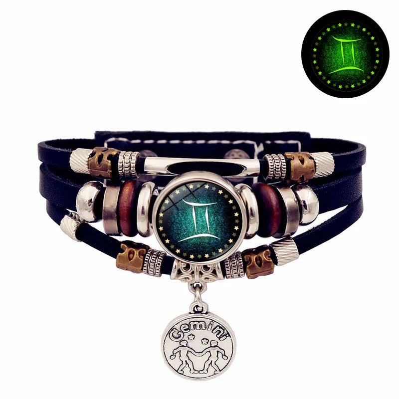 Multistrand bracelet with zodiac charm on a white background