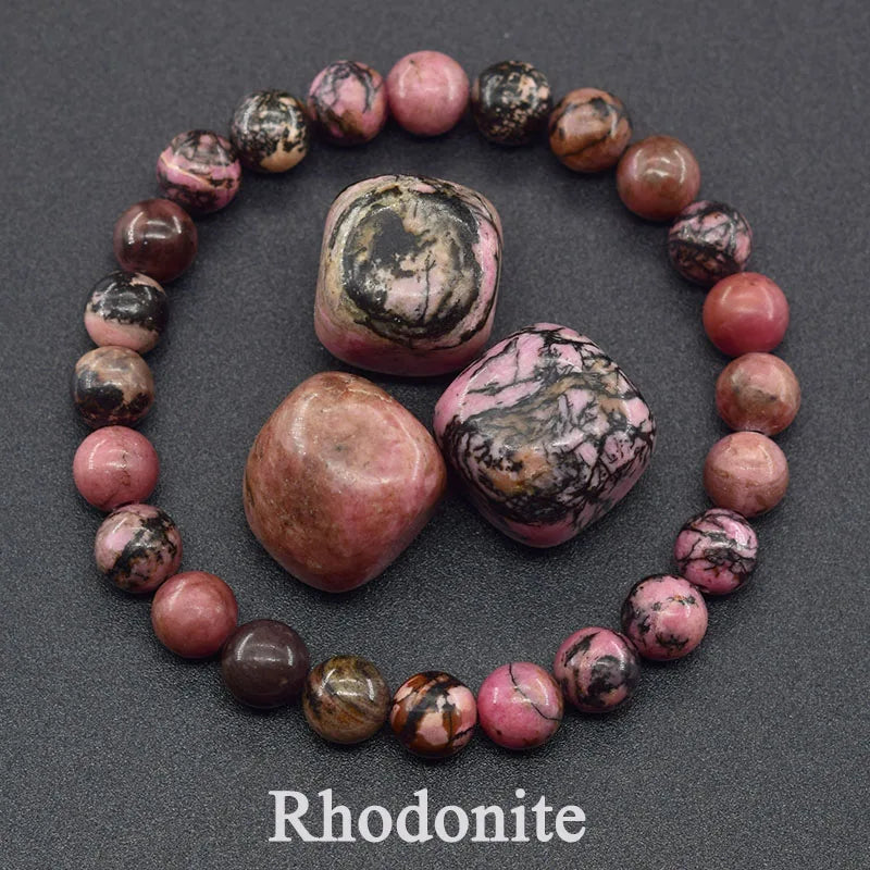 Necklace made of rhodonite stones on a dark background
