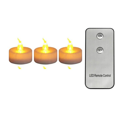 Three LED candles with a remote control on a white background