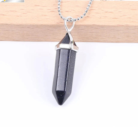Black crystal pendant necklace on a white background