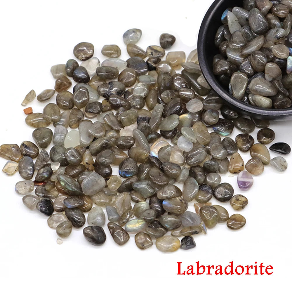 Labradorite stones with a bowl on a white background