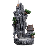 Decorative waterfall scene with rocks, trees, and a pagoda on a white background