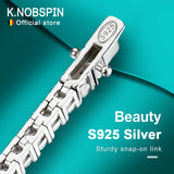 Silver bracelet with 'S925' stamp on a teal background, featuring K.NOBSPIN branding.