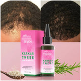 Sevich Karkar Chebe hair growth oil packaging and bottle on a pink background with green leaves.