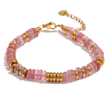 Bracelet with pink beads and gold accents on a white background