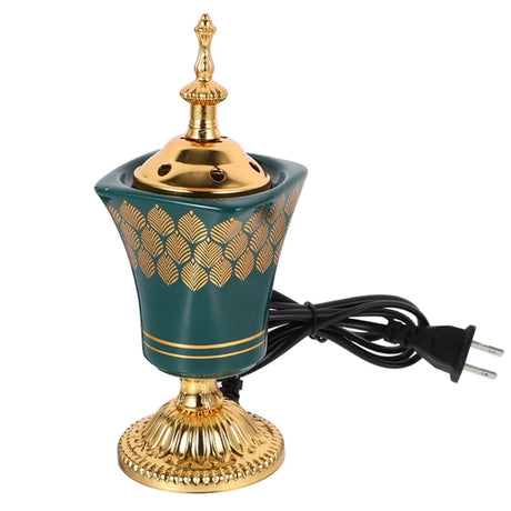 Decorative lamp with gold and green design on a white background