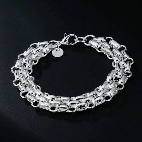 Silver chain bracelet on a black background